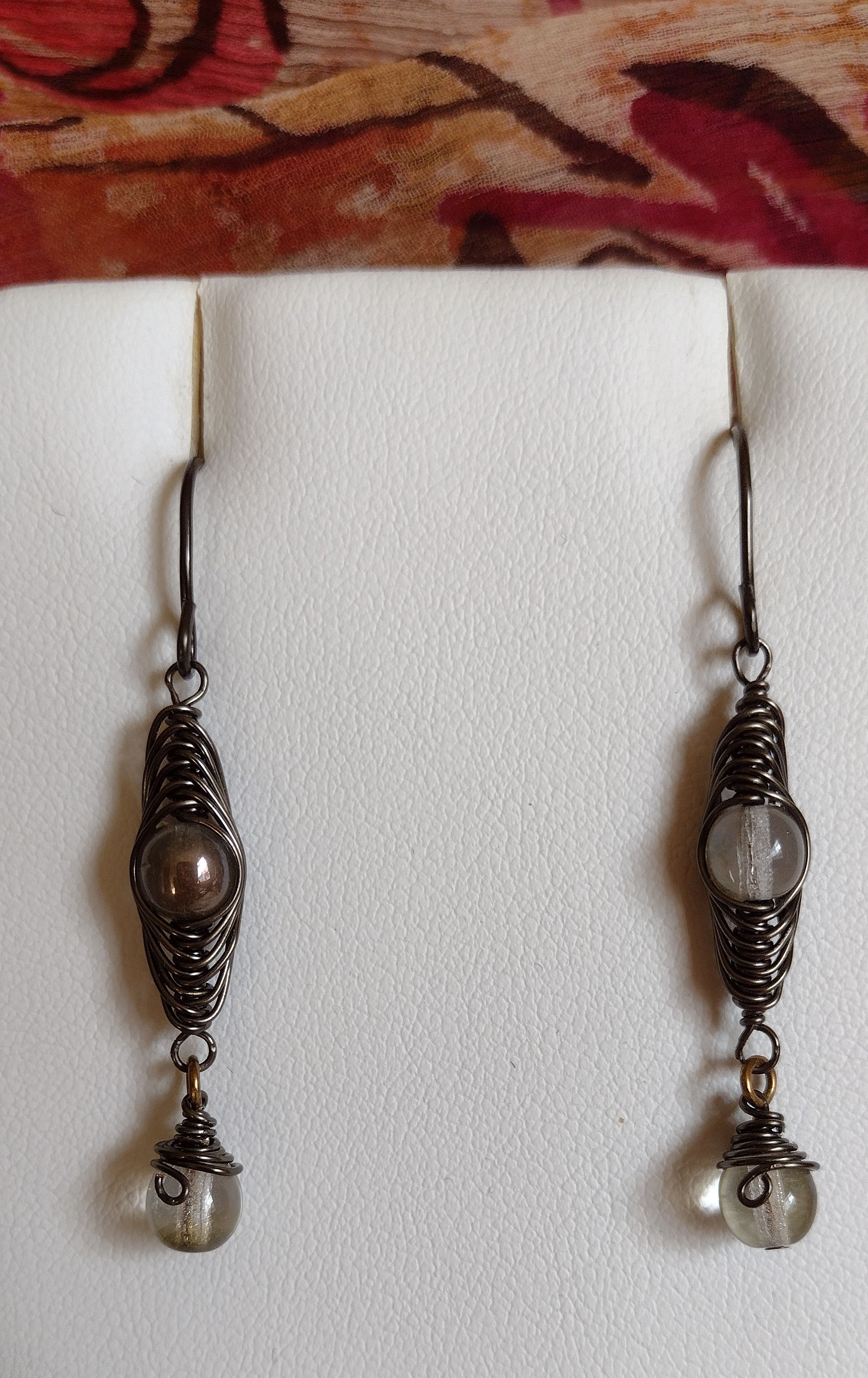Handmade earrings of hematite wrapped copper glass