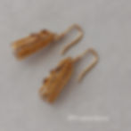 Hand knitted bronze earrings with chocolate glass accents