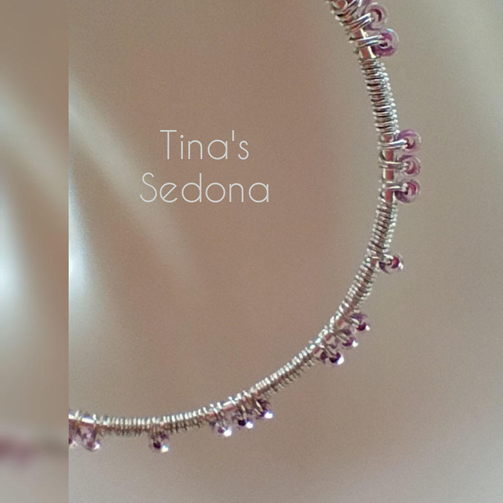 Handmade earrings of amethyst glass on wire wrapped silver