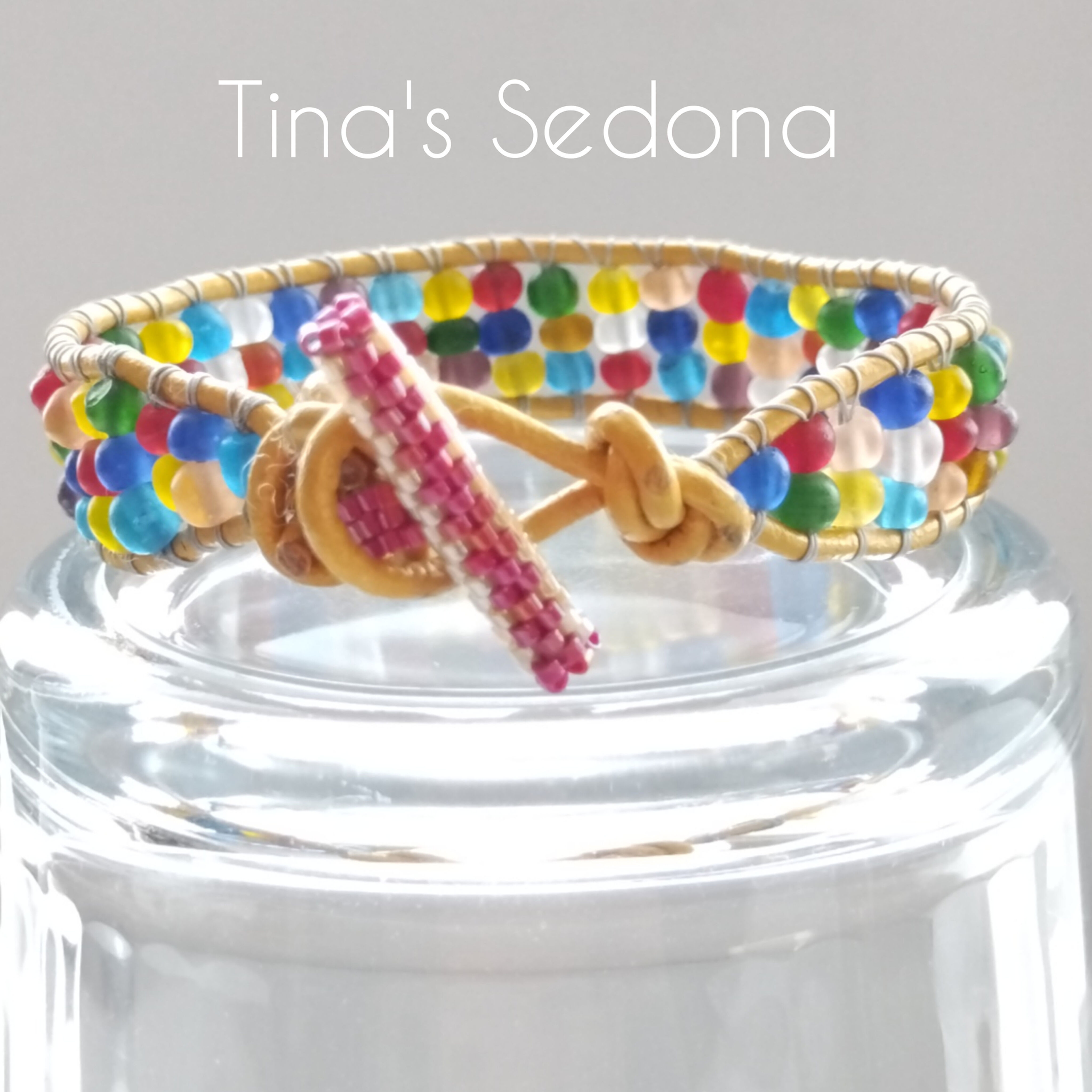 Handmade bracelet cuff of yellow leather wrapped multi glass beads