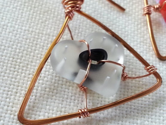Handmade earrings of fired glass heart and triangle