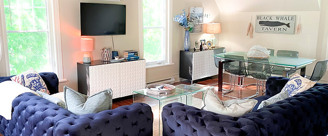 Bright and airy Nantucket Home living room with comfortable sofas and nautical decor