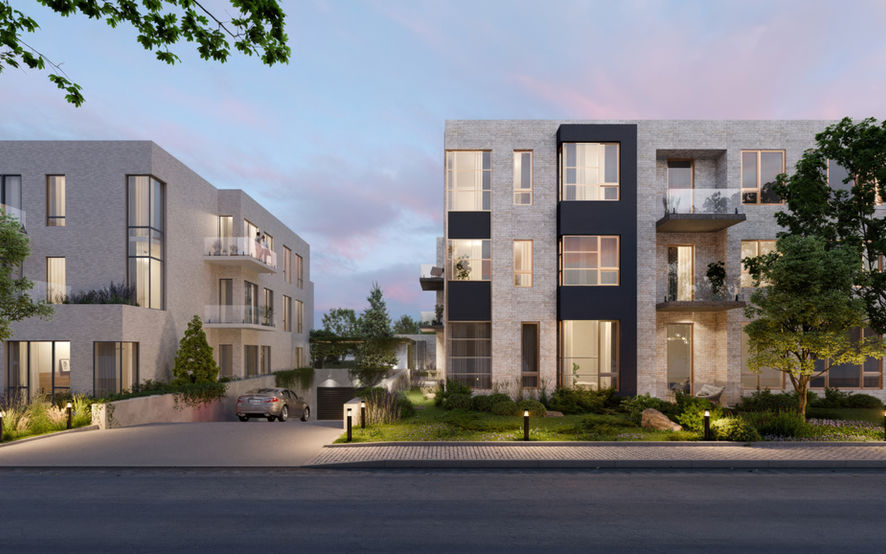 Moderno edificio residencial de apartamentos con grandes ventanales y balcones, rodeado de vegetación e iluminación ambiental al atardecer. Hay un coche estacionado cerca de la entrada del edificio y la arquitectura presenta un diseño minimalista con elementos en gris claro y negro.