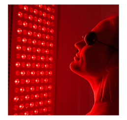 woman's face in front of red light panel