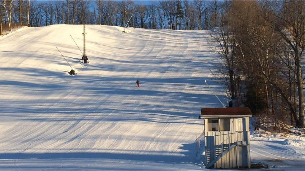 a person snowboarding on a trail of batawa ski resort