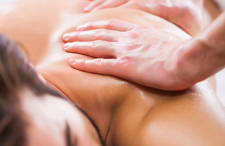 Young man is enjoying massage on spa tre