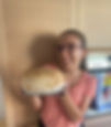 Greta with her homemade gluten-free bread. Photo credit: @celiachia_invaligia