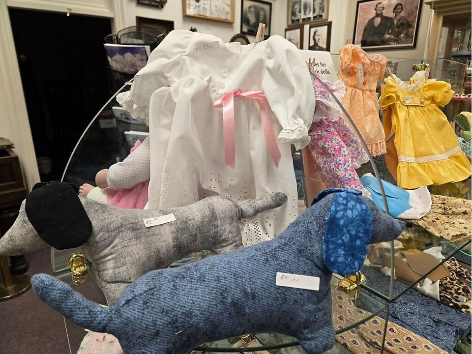 Handmade stuffed dog toys available at the Pioneer Museum Gift Shop, perfect for gifts or collectors.
