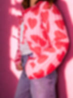 Cropped quilted jacket in pink with allover heart pattern.