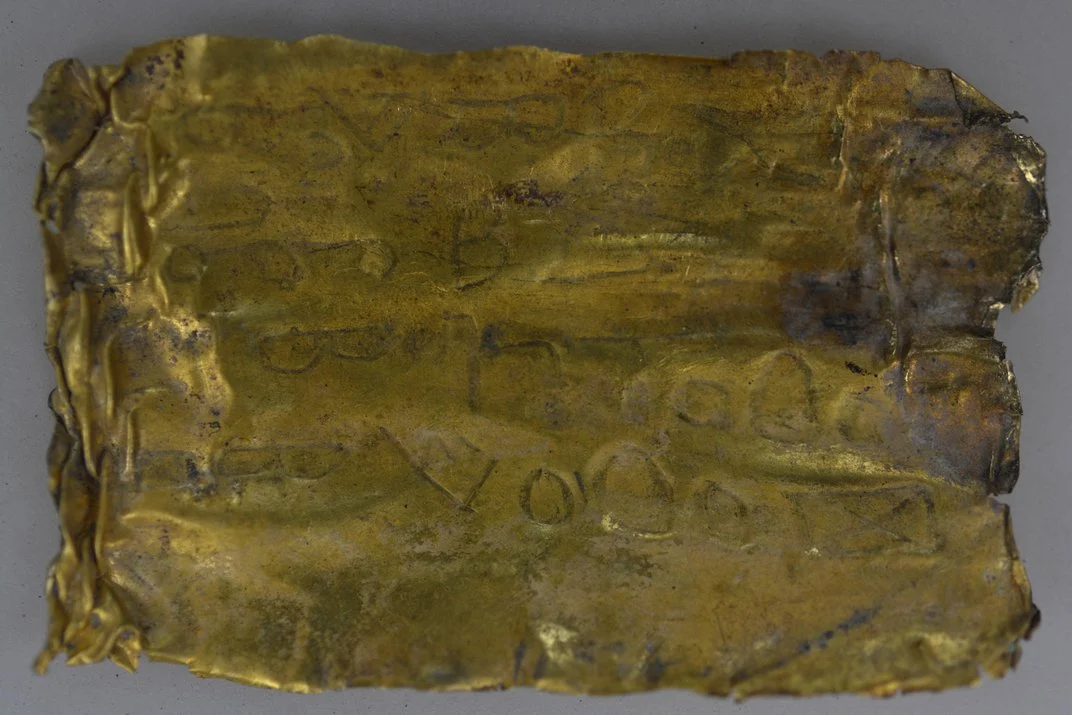 This 2,000-year-old scroll is covered with mysterious words in Aramaic. Miomir Korac/Archaeological Institute