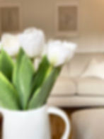 close up white faux tulip bouquet