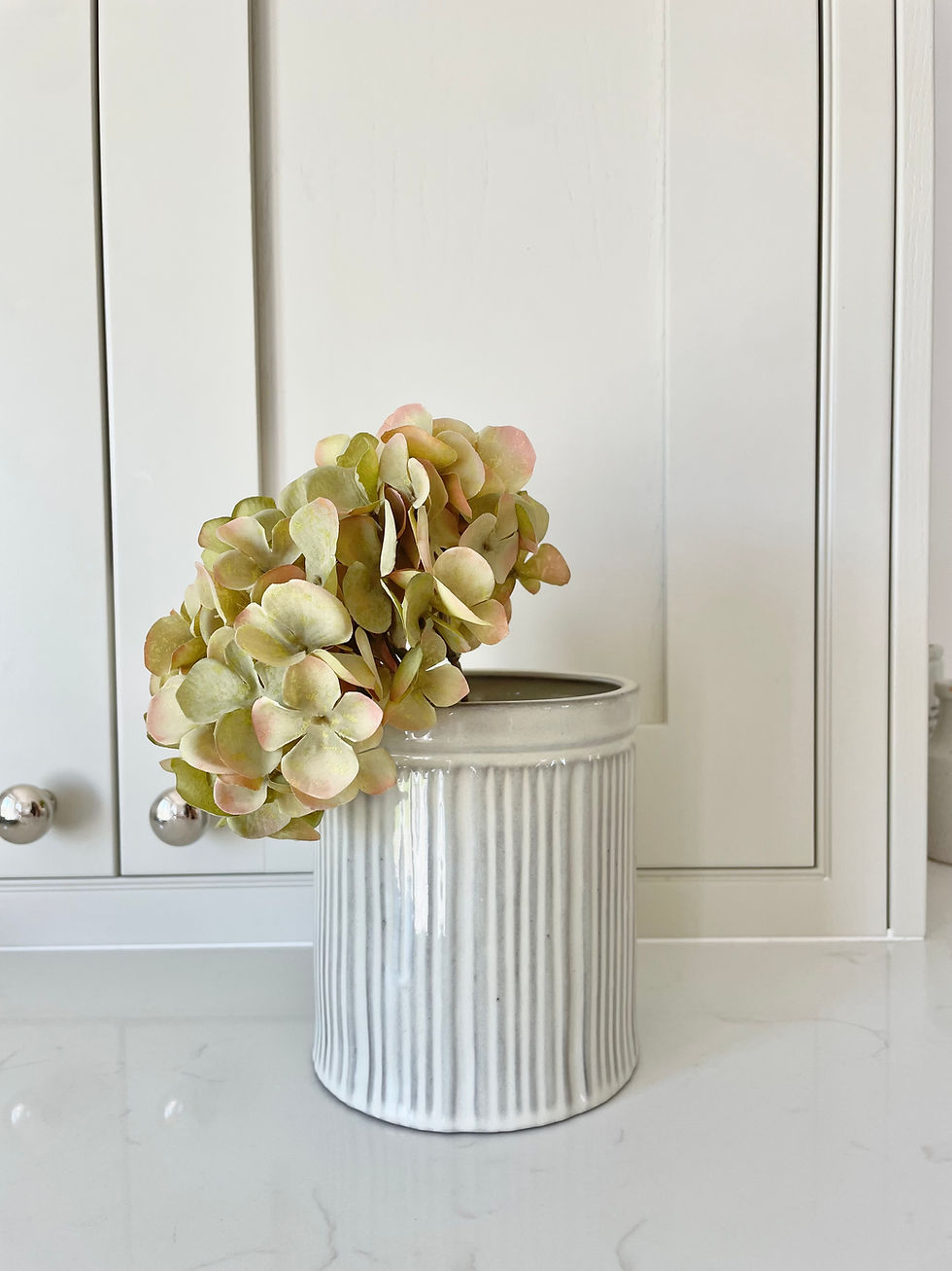 Thumbnail: utensil jar with flowers