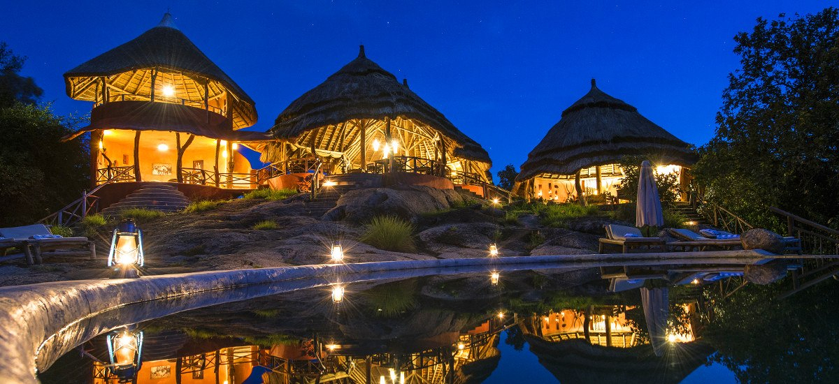 This image shows Mihingo Lodge - a luxury safari retreat located high on a rocky kopje overlooking Lake Mburo National Park in Uganda.