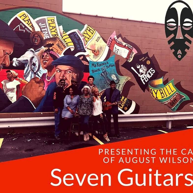 Cast of August Wilson's Seven Guitars in front of a mural