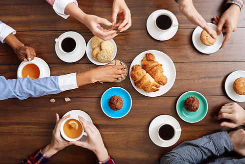 people-hands-wooden-table-with-croissants-coffee.jpg