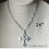 Thumbnail: SILVER HAMMERED CROSS Necklace