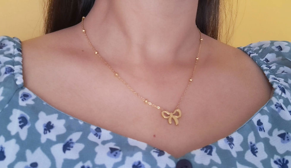 Thumbnail: Dainty Gold Bow Necklace
