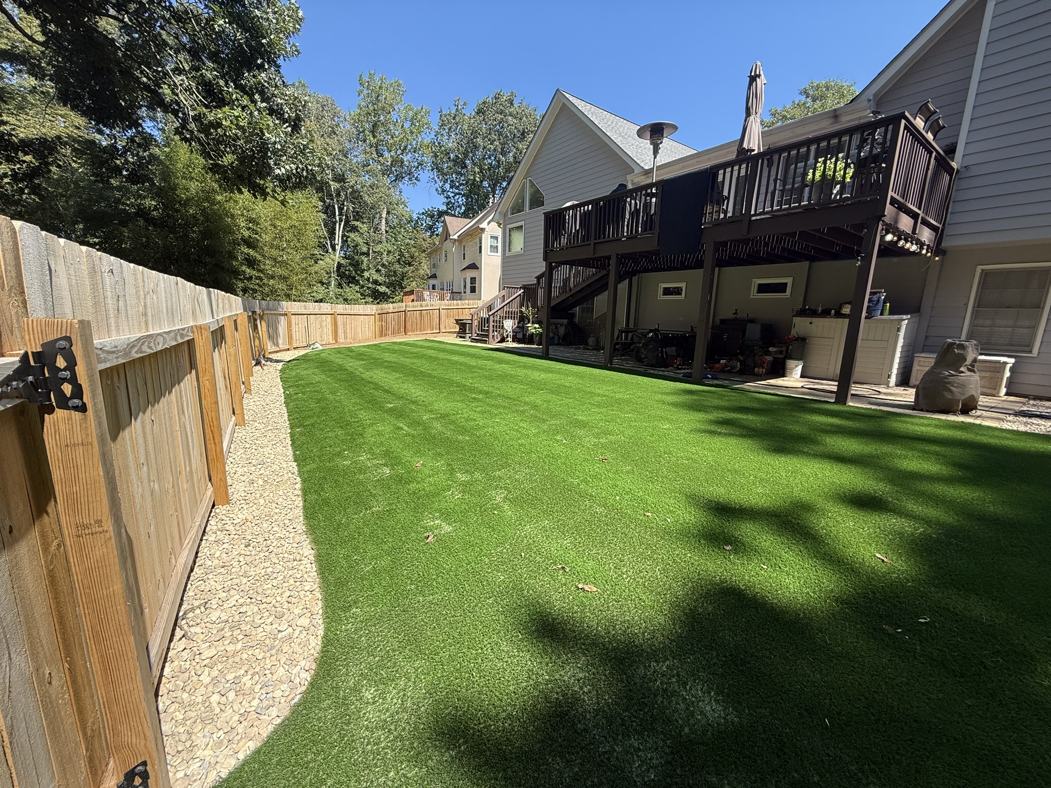 A lush artificial turf lawn installed by Dixon Landscape Services