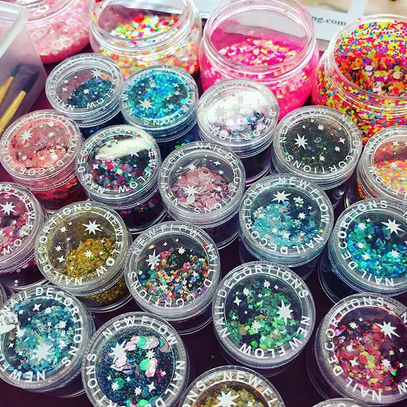 Pots of colourful cosmetic glitter