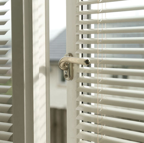 White perfect fit blind on patio doors.