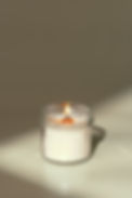 candles-in-glass-jars-on-a-light-beige-surface-2025-02-24-17-39-29-utc.jpg
