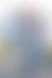 Seattle family of 5, teenage son and daughter with a 7 year old boy, pose together in front of the Puget Sound at Discovery Park.