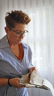 Interior designer guiding a client through design decisions and selections.