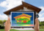 Close-up Of Person Detecting Heat Loss Outside The House Using Digital Tablet.jpg