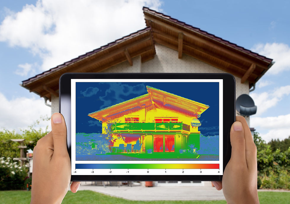 Close-up Of Person Detecting Heat Loss Outside The House Using Digital Tablet.jpg