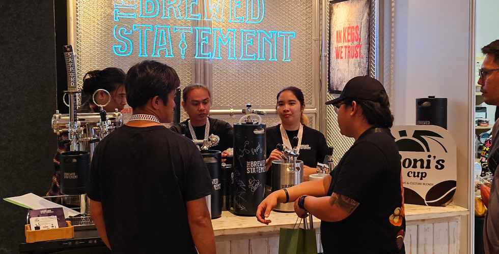 People standing in front of a Coffee Booth