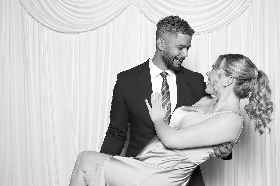Smiling couple in a Black and White Photo Booth