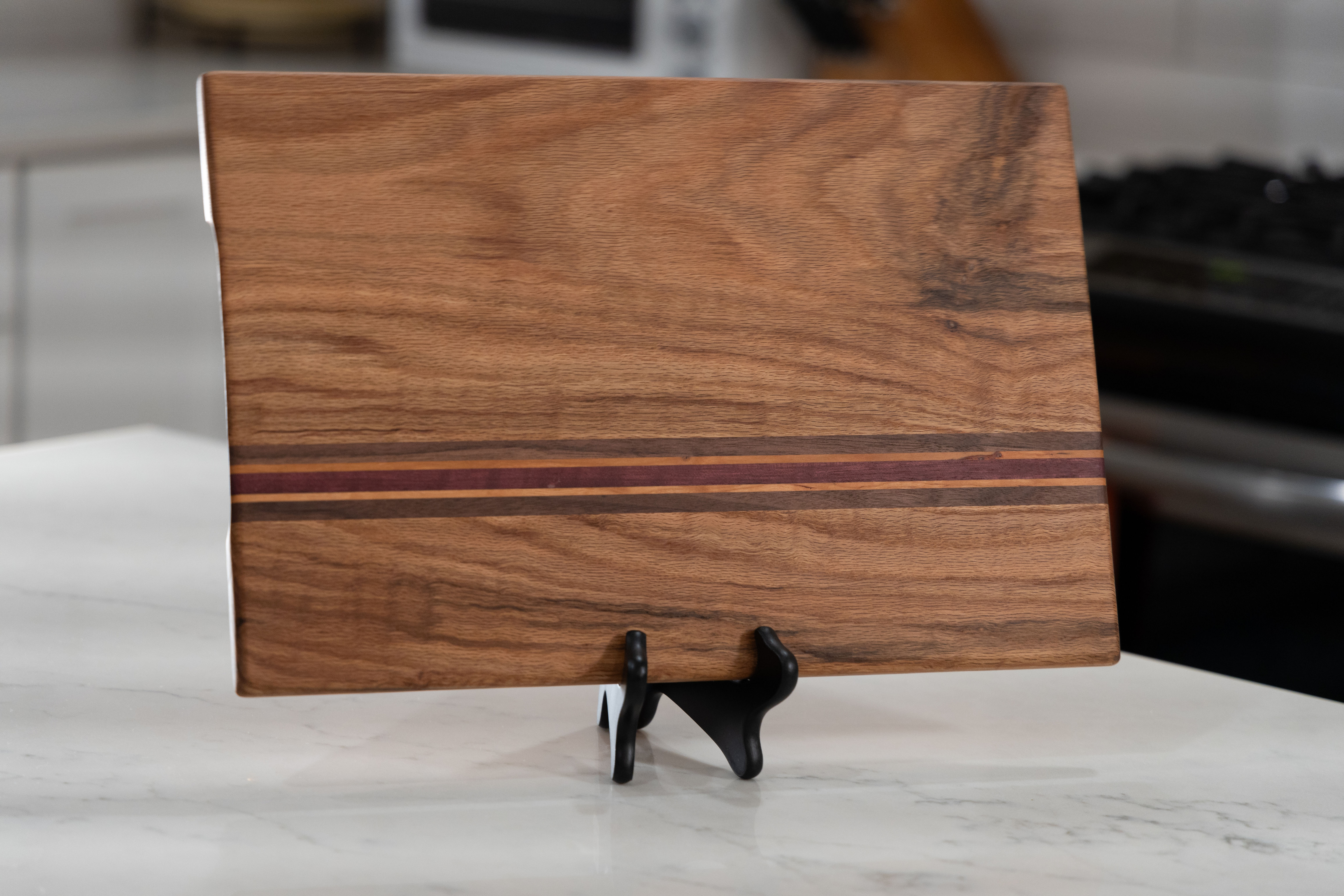 Red oak face grain cutting board with decorative stripe