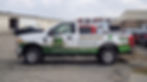 White SUV with commercial graphic vehicle wrap EZ Power Washing Services branding
