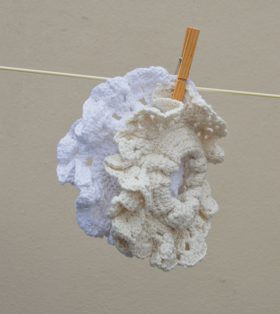 Thumbnail: Primrose crochet scrunchie hanging on a line