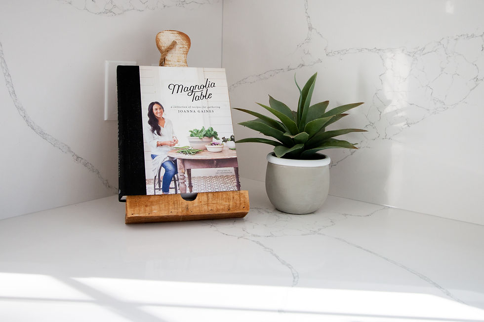 quartz slab backsplash, magnolia table cookbook, cookbook, succulent, indoor plant, caldera calacatta quartz, quartz counters, countertops, manmade, white countertops, kitchen design, kitchen remodel, husky builders, South Carolina, interior design, interior designer, grits grace and granola