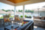 husky builders, covered porch, tongue and groove ceiling, rock wall, stamped patio, stamped concrete, drainage challenge, concrete, concrete finishes, outdoor oasis, patio, stamped, outdoor patio ideas, greenville south carolina contractors, construction, concrete
