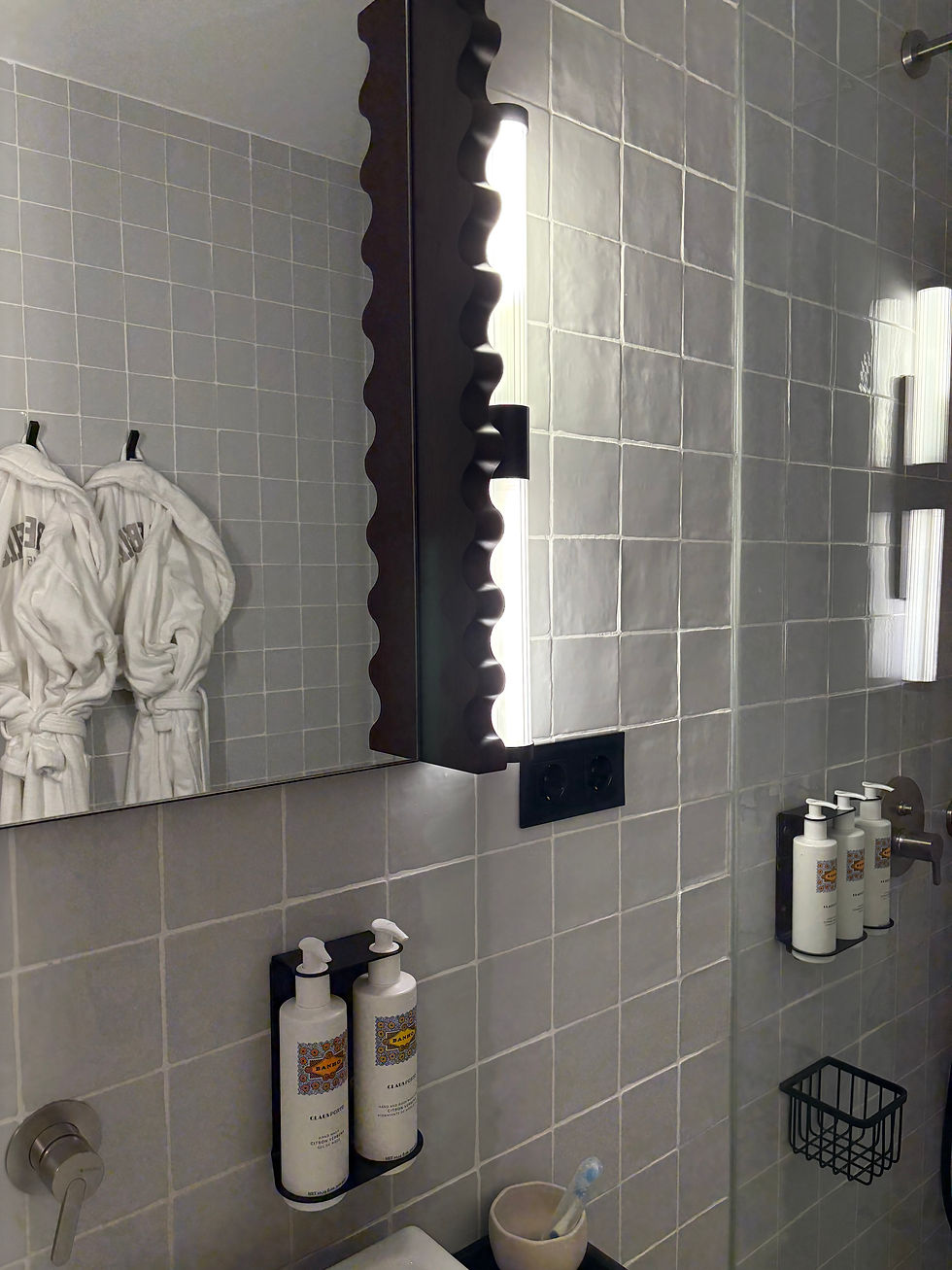 I followed the glow to find my very own ensuite, brimming with amenities and a cosy Rebello robe.