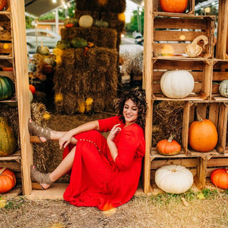 Christian woman with curly hair in a modest, feminine wardrobe, representing biblical modesty, beauty, and honoring God with the body