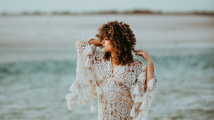 curly girl at the beach