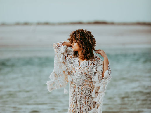 curly girl at the beach