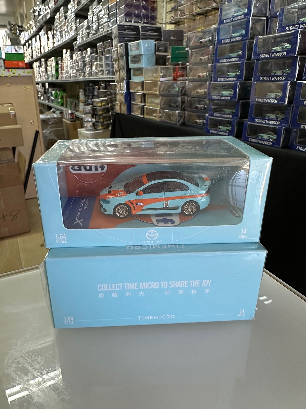 Thumbnail: MITSUBISHI LANCER EVO X GULF LIVERY 1/64 DIECAST CAR MODEL BY TIME MICRO