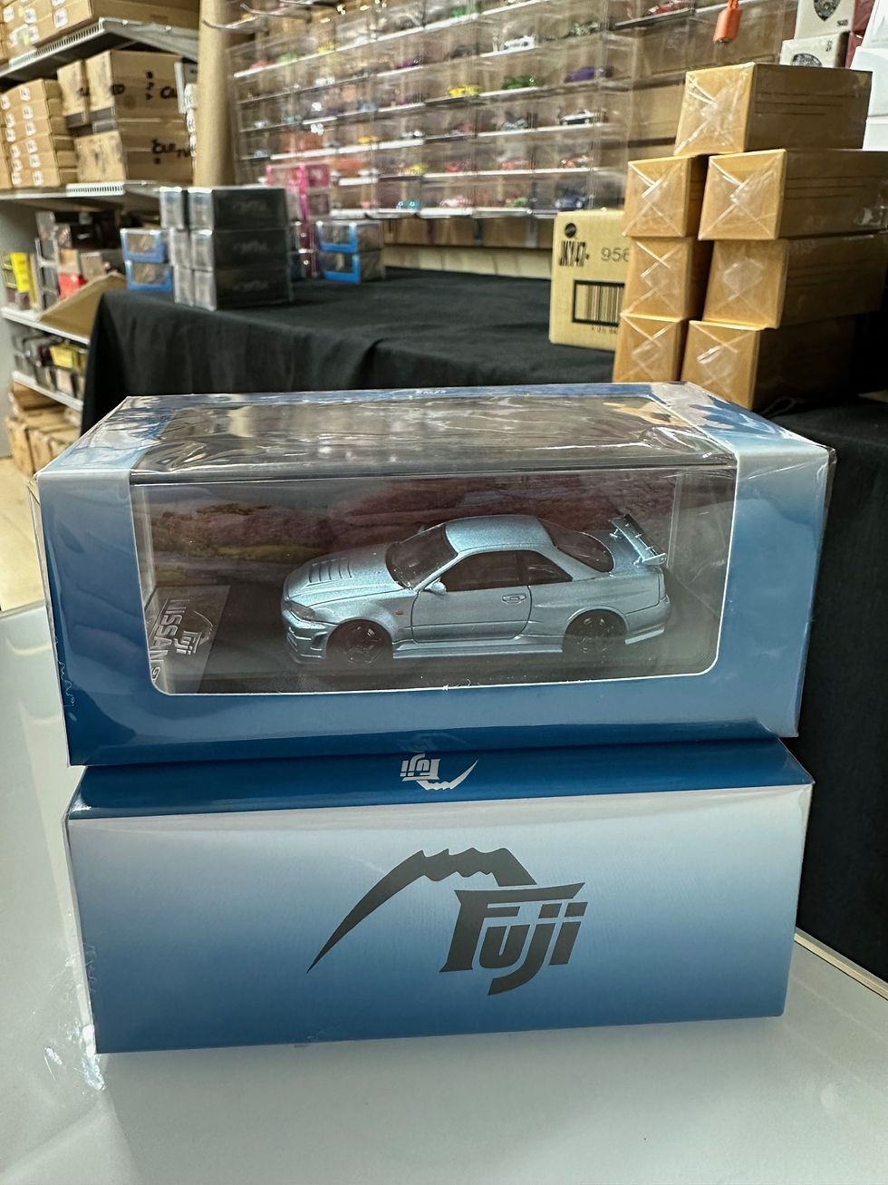 Thumbnail: NISSAN SKYLINE GT-R R34 NISMO Z-TUNE HI END ICE BLUE 1/64 DIECAST CAR BY FUJI