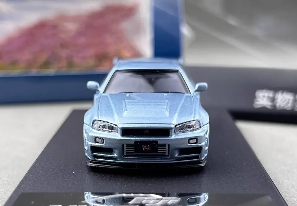 Thumbnail: NISSAN SKYLINE GT-R R34 NISMO Z-TUNE HI END ICE BLUE 1/64 DIECAST CAR BY FUJI