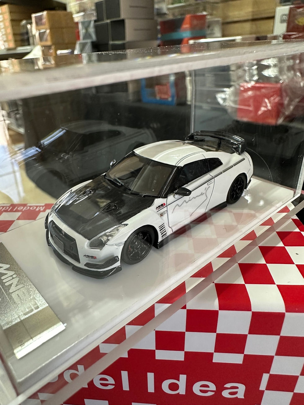 Thumbnail: NISSAN SKYLINE GT-R R35 MINES WHITE CARBON HOOD 1/64 RESIN CAR BY MODEL IDEA
