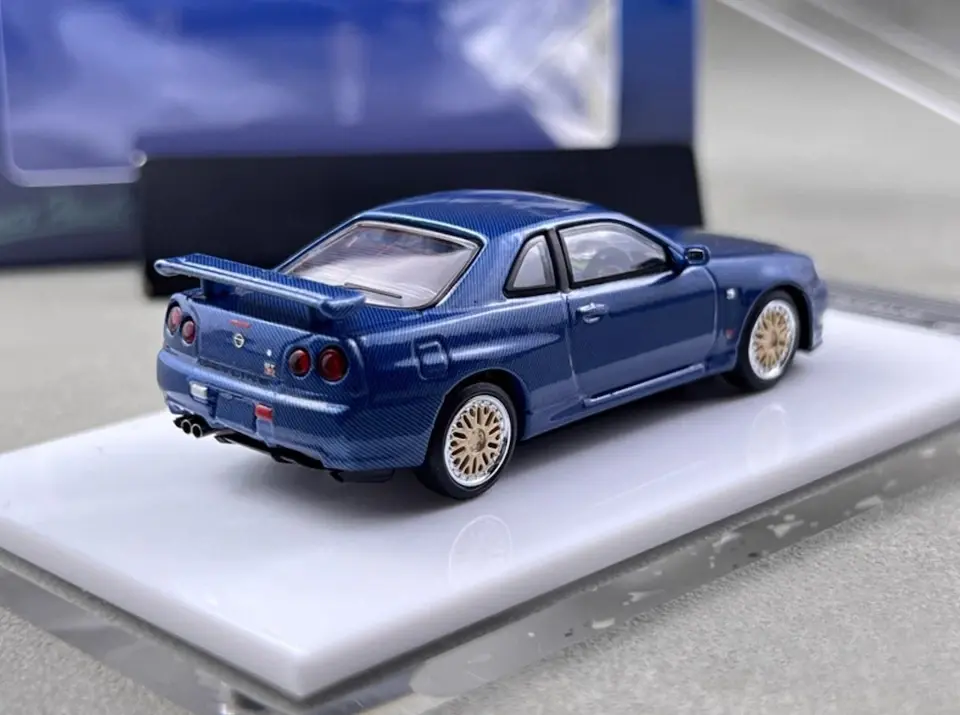 Thumbnail: NISSAN SKYLINE GT-R R34 BLUE FULL CARBON 1/64 DIECAST CAR BY STANCE HUNTERS
