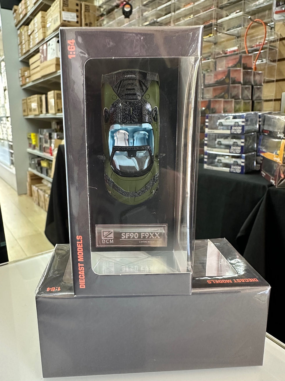 Thumbnail: FERRARI MANSORY SF90 F9XX ROADSTER MILITARY GREEN 1/64 DIECAST CAR BY DCM