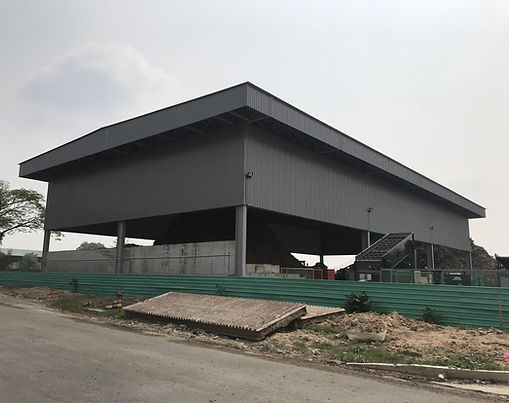 Temporary open shed for industrial waste recycling at Sarimbun