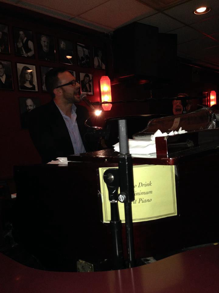 Gregory is entertaining a packed piano bar in Downtown Chicago. He's singing and playing at the piano while the patrons all sing along
