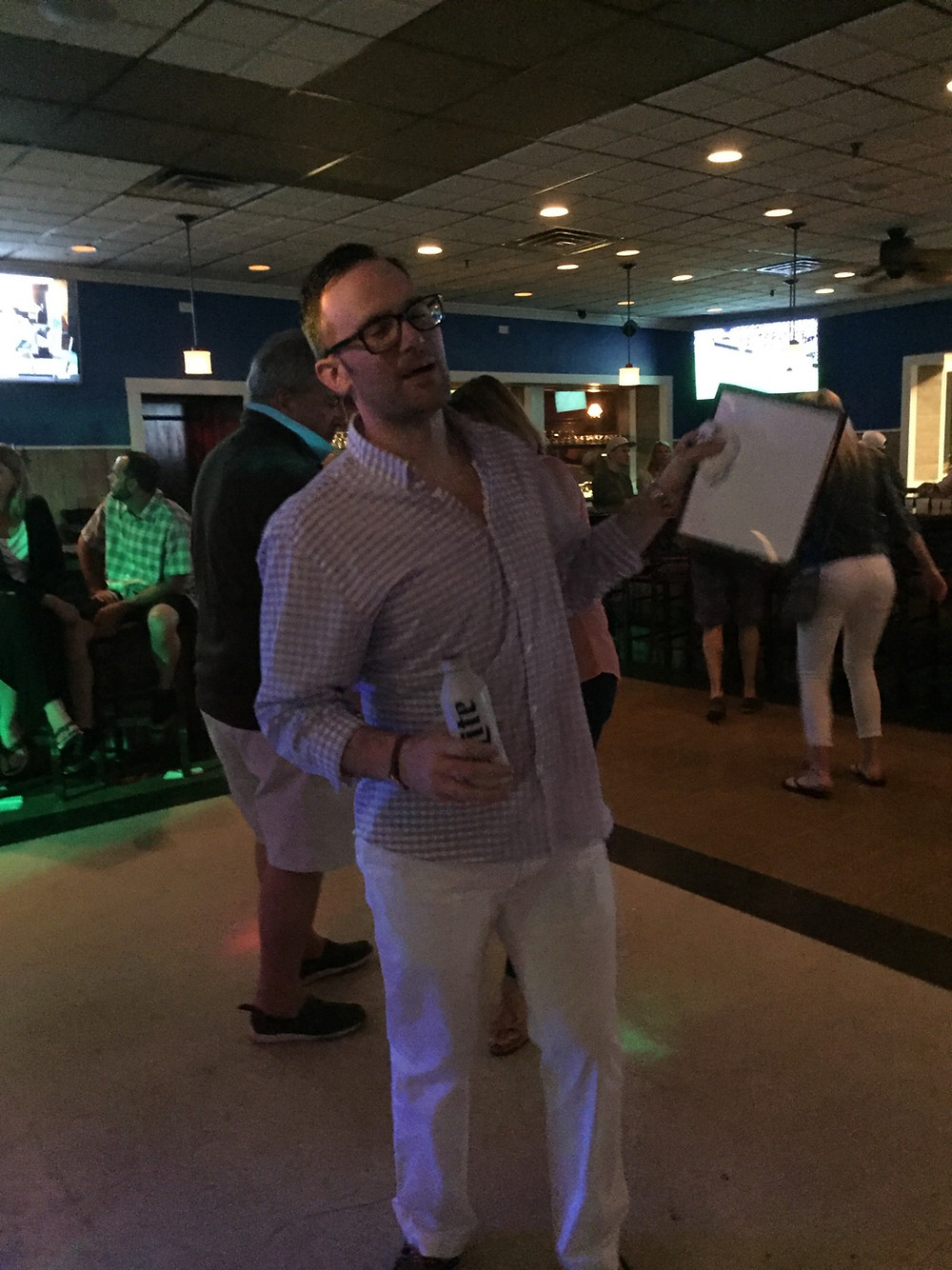 The author on the dance floor displaying his whiteboard.