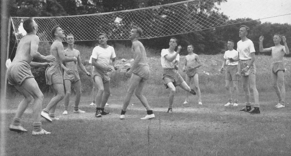 Group of men playing volleyball